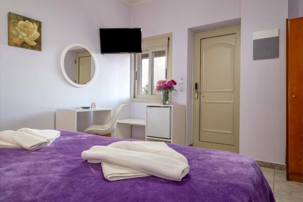Posteľ alebo postele v izbe v ubytovaní Areti Suites