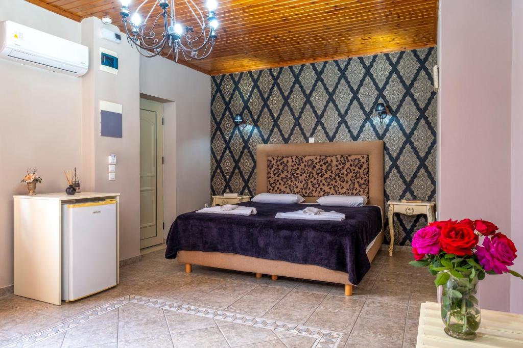 Posteľ alebo postele v izbe v ubytovaní Areti Suites