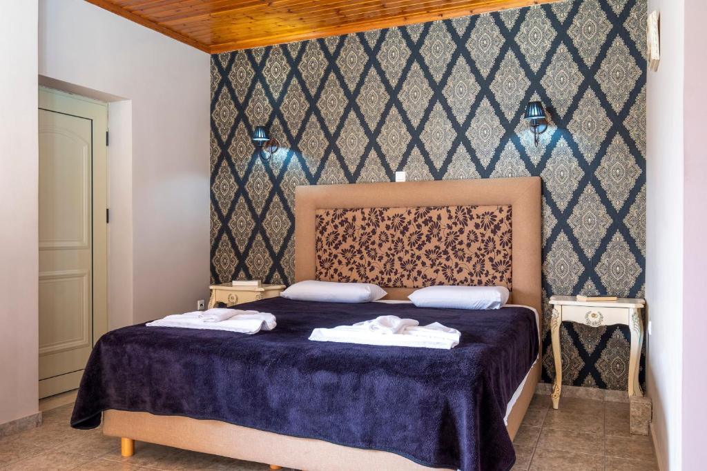 Posteľ alebo postele v izbe v ubytovaní Areti Suites