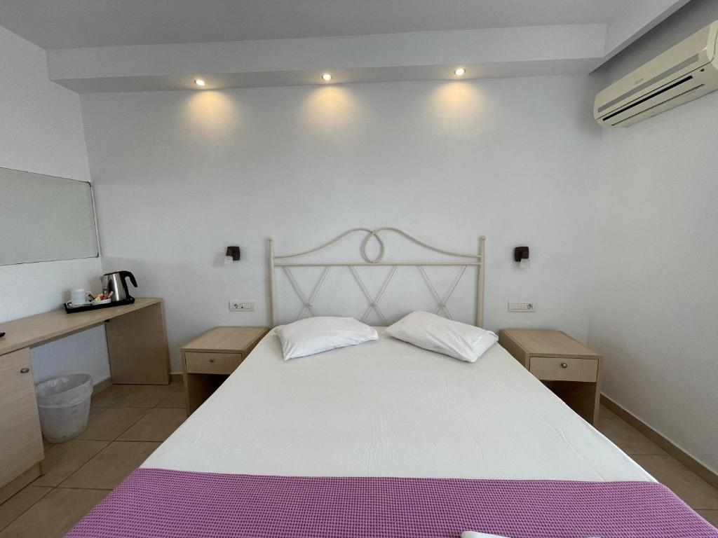 Postel nebo postele na pokoji v ubytování Island Resorts Maya (ex Valynakis)