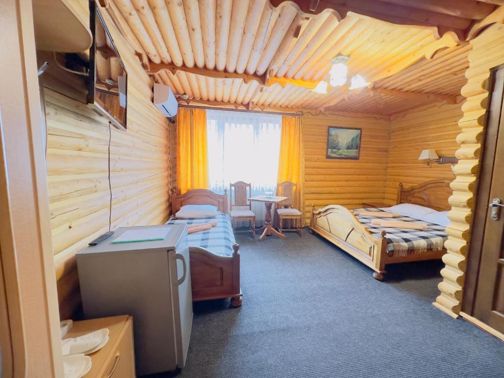 Postel nebo postele na pokoji v ubytování Trembita