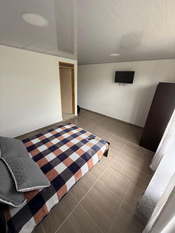 Voodi või voodid majutusasutuse Aparta hotel Brisas de salento toas