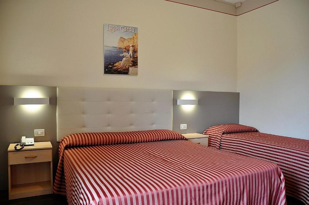 Postel nebo postele na pokoji v ubytování Hotel Panoramica