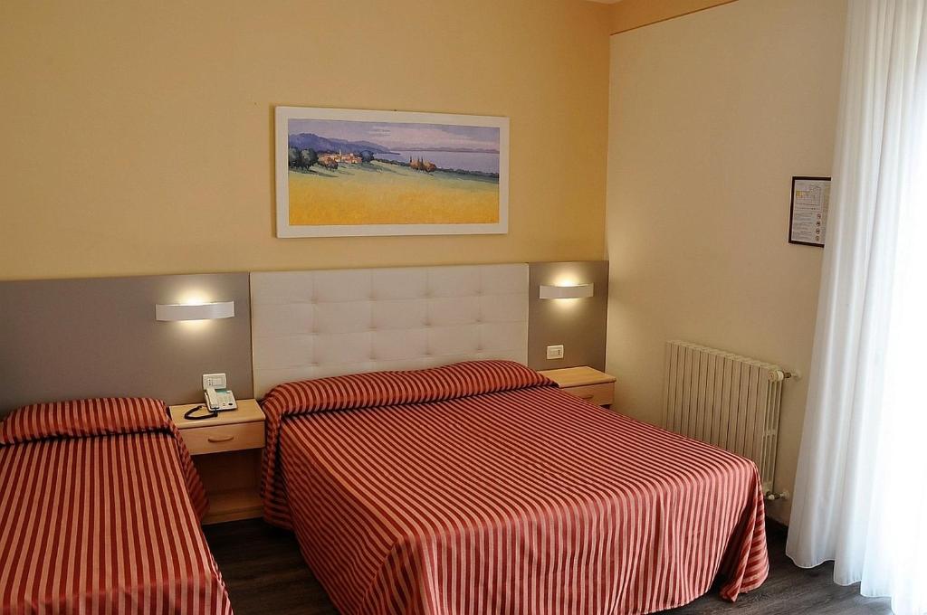 Postel nebo postele na pokoji v ubytování Hotel Panoramica