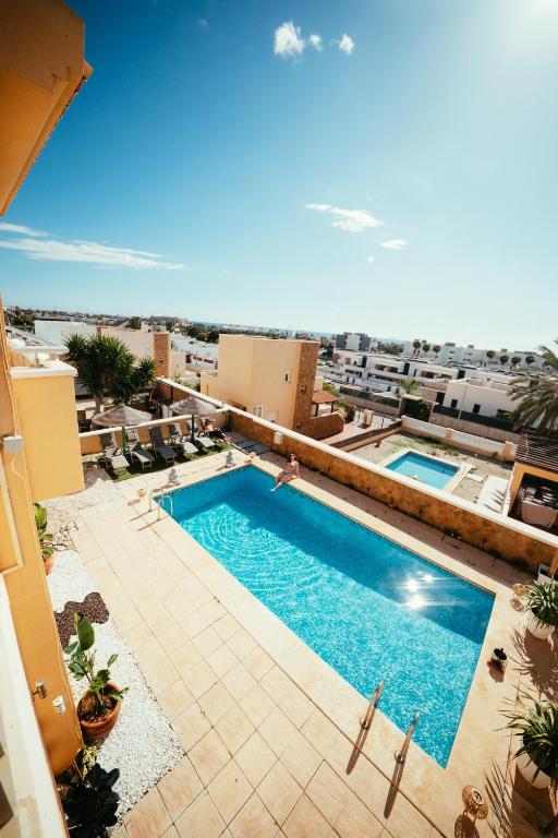 an overhead view of a swimming pool on top of a building at Villa Dahi Almerimar 10 Guest, Prive Pool, Prive Bar, BBQ, Sea Views in Almerimar