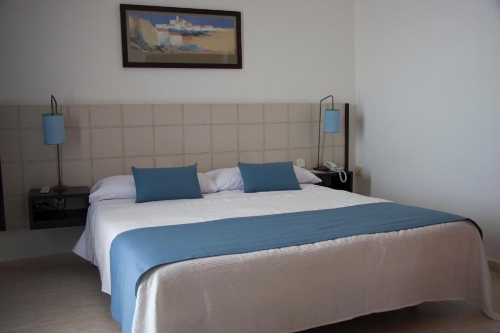 Postel nebo postele na pokoji v ubytování Hotel Sicania