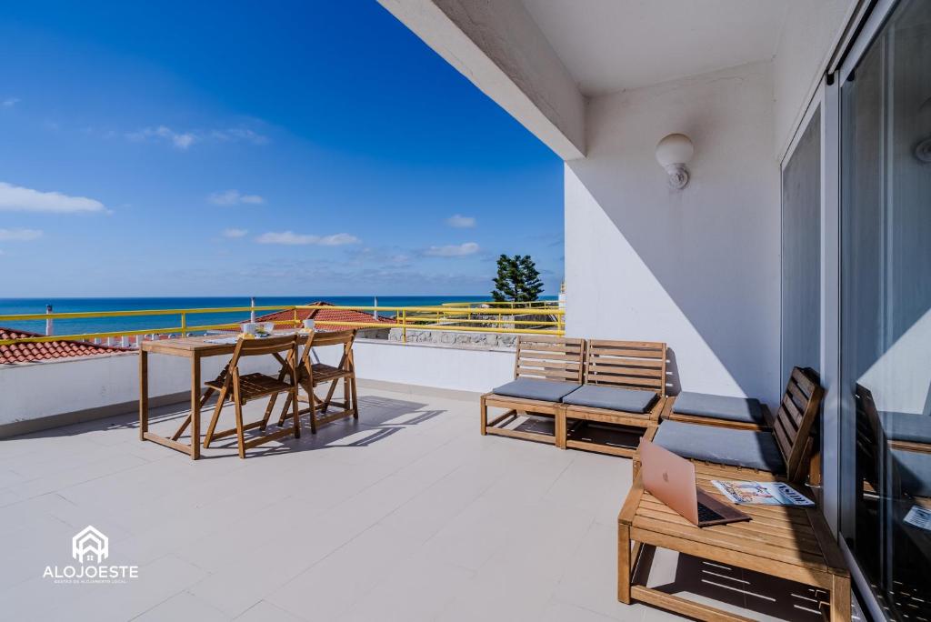a balcony with a view of the ocean at Ericeira Panoramic Sea View Apartments in Ericeira