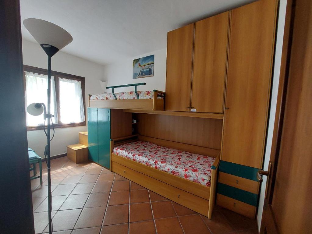 Łóżko lub łóżka w pokoju w obiekcie "Sardinia Blue Home" Vista mare, tramonti mozzafiato su Golfo Asinara, giardino, parking e Wi-Fi