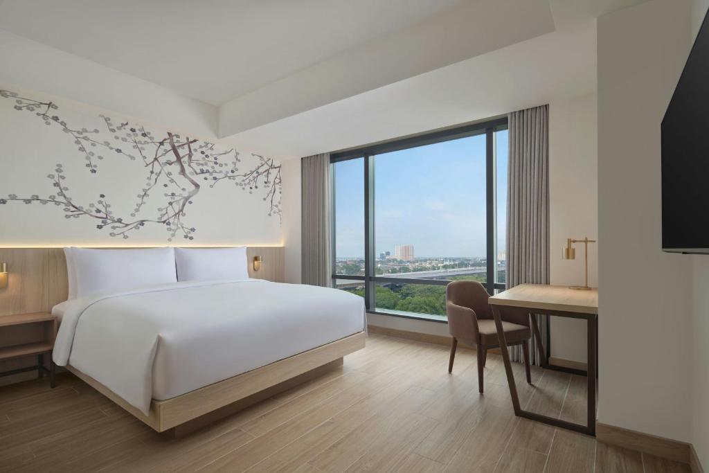 Postel nebo postele na pokoji v ubytování Fairfield by Marriott Bekasi