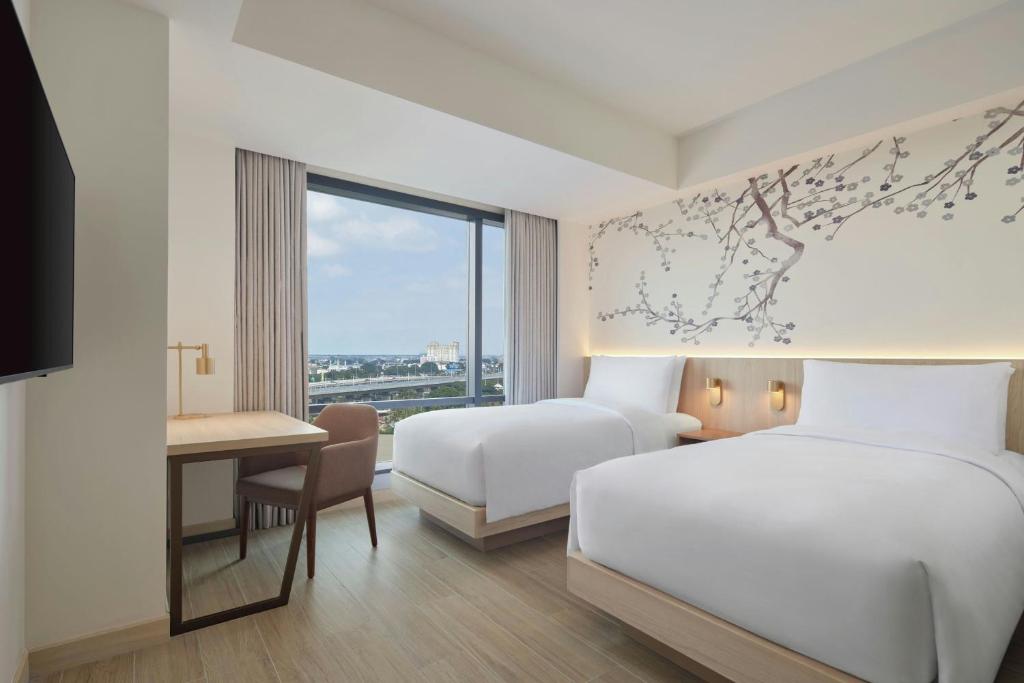 Postel nebo postele na pokoji v ubytování Fairfield by Marriott Bekasi