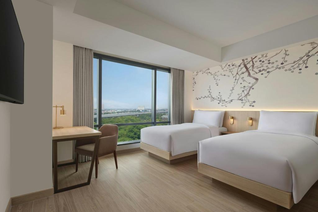 Postel nebo postele na pokoji v ubytování Fairfield by Marriott Bekasi