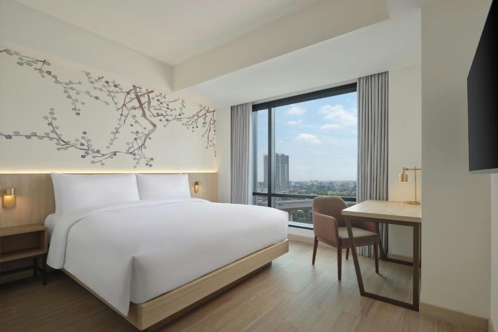 Postel nebo postele na pokoji v ubytování Fairfield by Marriott Bekasi