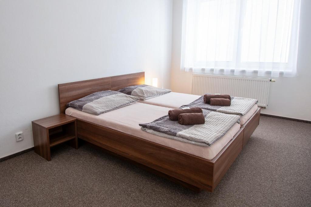 Postel nebo postele na pokoji v ubytování Penzion Na Dlouhé