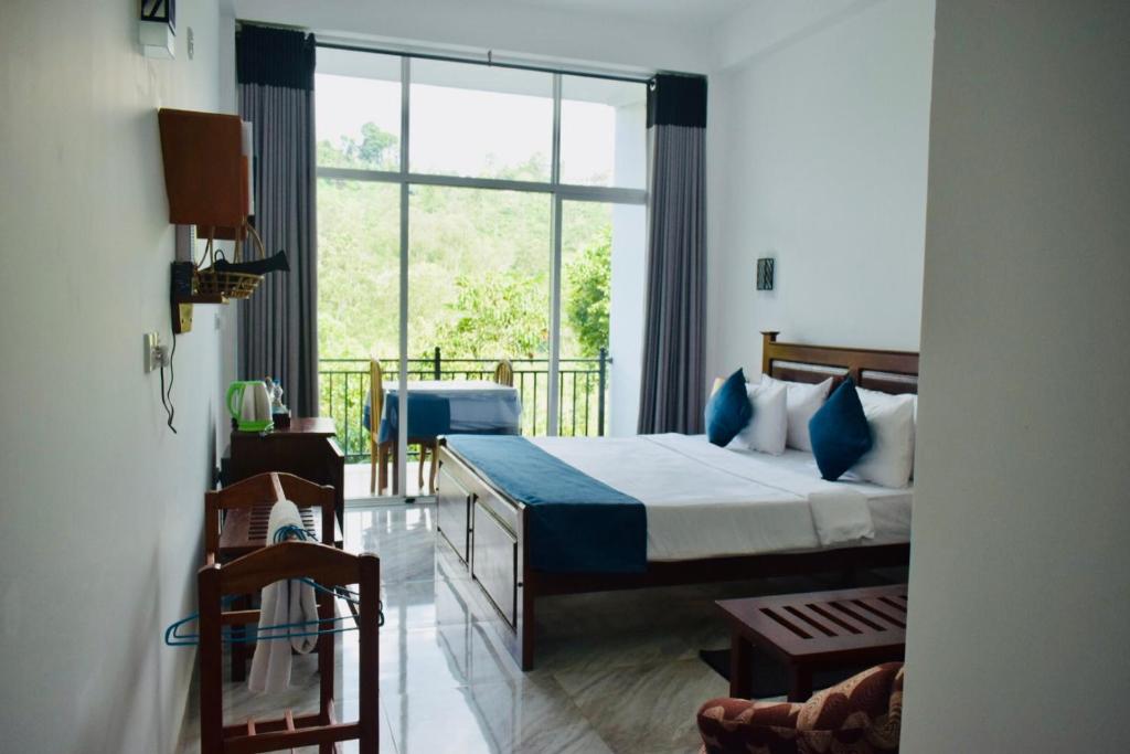 Postel nebo postele na pokoji v ubytování Relax Inn