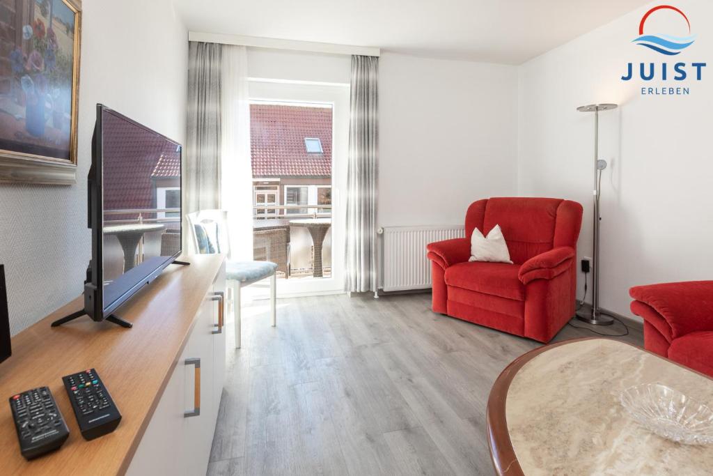 TV a/nebo společenská místnost v ubytování Haus Sylke 137 - Ferienwohnung 7