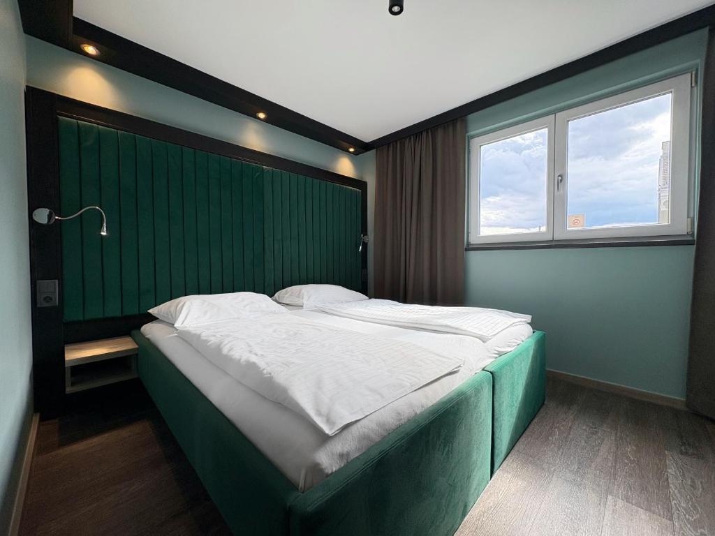 Posteľ alebo postele v izbe v ubytovaní Smart Hotel Schönbrunn