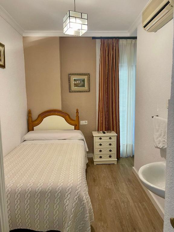 Postel nebo postele na pokoji v ubytování Pension Zurita