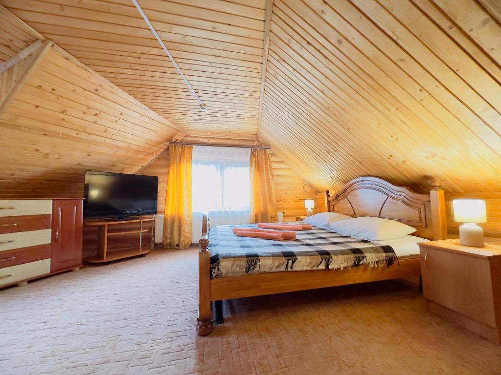 Postel nebo postele na pokoji v ubytování Trembita