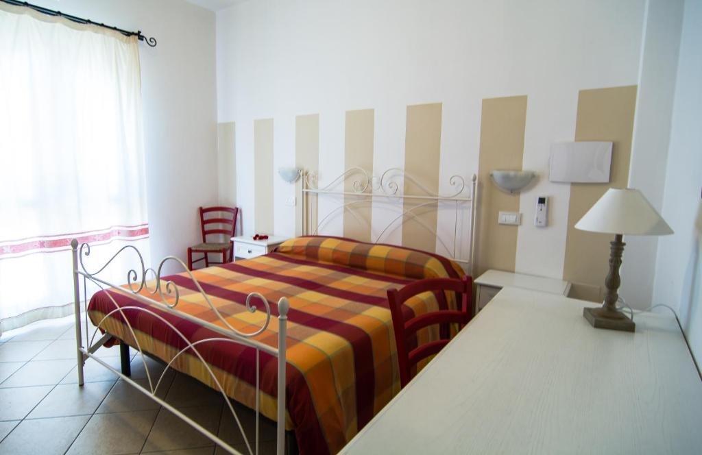 Postel nebo postele na pokoji v ubytování Hotel Stella D'Oro