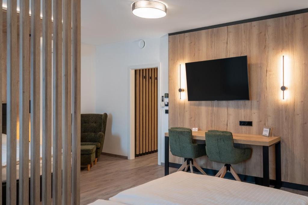 Televízia a/alebo spoločenská miestnosť v ubytovaní City Hotel Stockerau