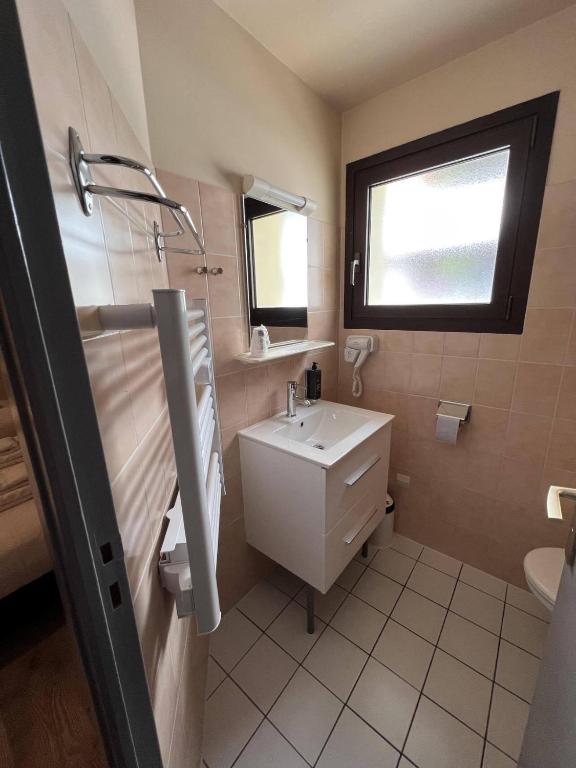 Koupelna v ubytování Au Bec Fin Hôtel