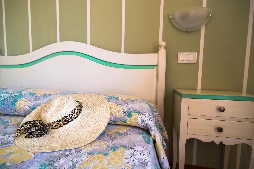 Postel nebo postele na pokoji v ubytování Hotel Stella D'Oro
