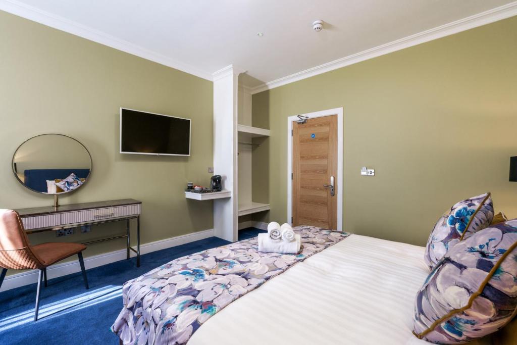 Postel nebo postele na pokoji v ubytování Troysgate House