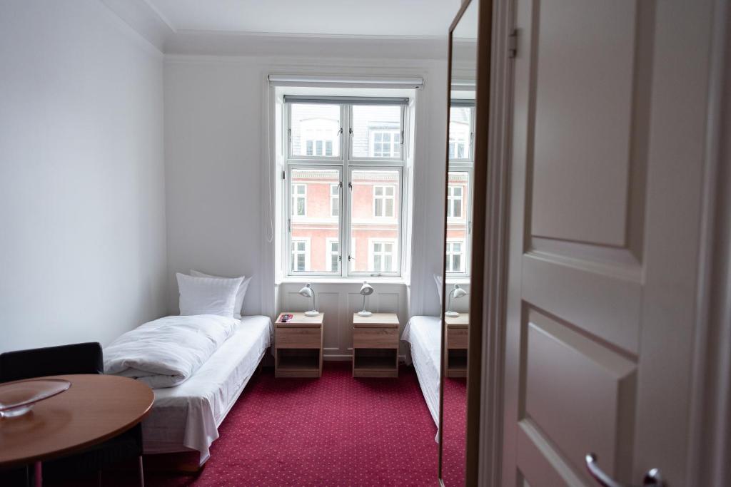 Postel nebo postele na pokoji v ubytování Hotel Nora Copenhagen