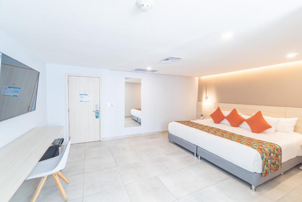 Postel nebo postele na pokoji v ubytování Hotel Barlovento