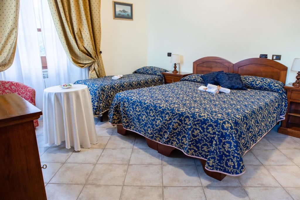 Postel nebo postele na pokoji v ubytování Hotel Il Cavalier D'Arpino