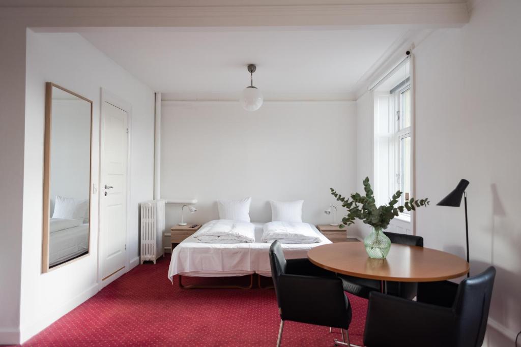 Postel nebo postele na pokoji v ubytování Hotel Nora Copenhagen