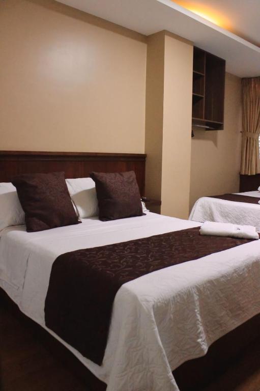 Postel nebo postele na pokoji v ubytování HOSTAL CAMIL