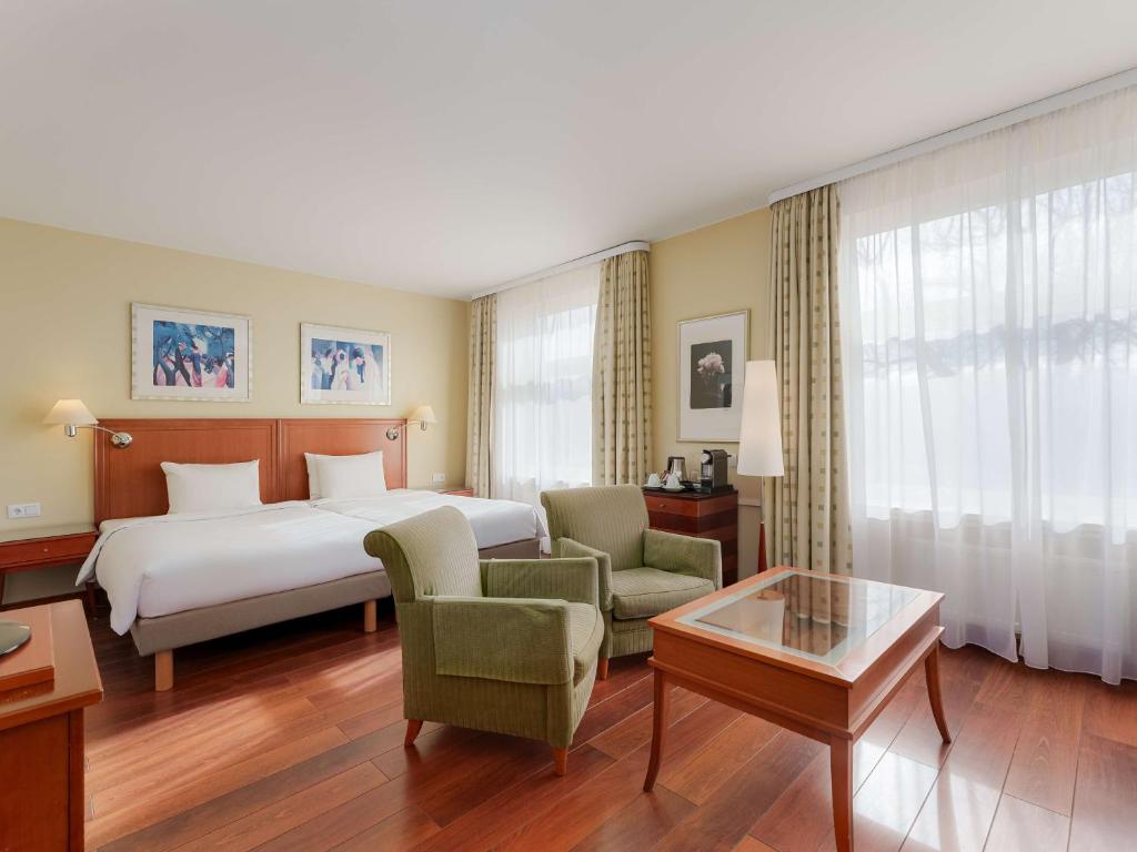 Postel nebo postele na pokoji v ubytování Radisson Blu Ridzene Hotel, Riga