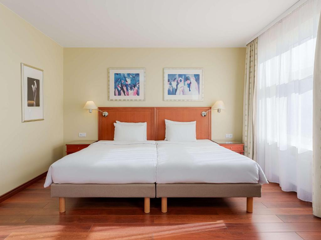 Postel nebo postele na pokoji v ubytování Radisson Blu Ridzene Hotel, Riga
