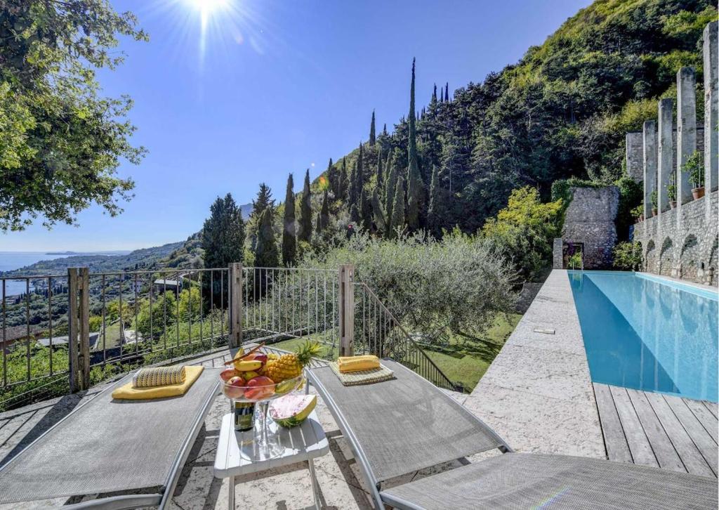 a villa with a view of a mountain at Le Ravere Luxury Mini-Resort - a structure for 12 in Gargnano