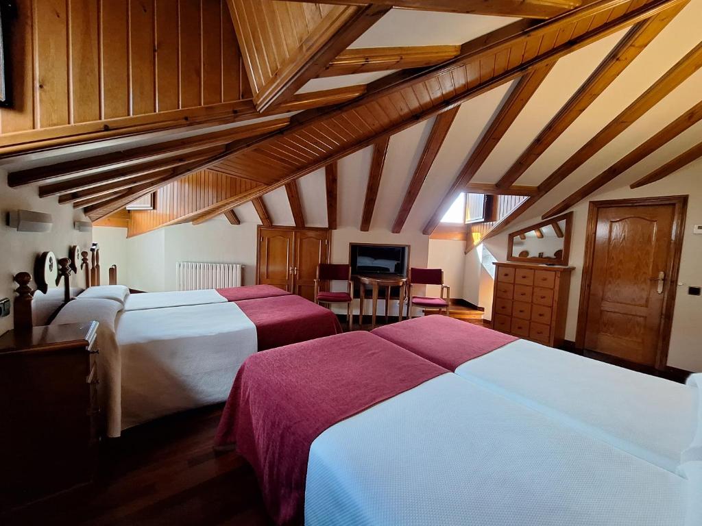 Postel nebo postele na pokoji v ubytování Hotel Aragüells