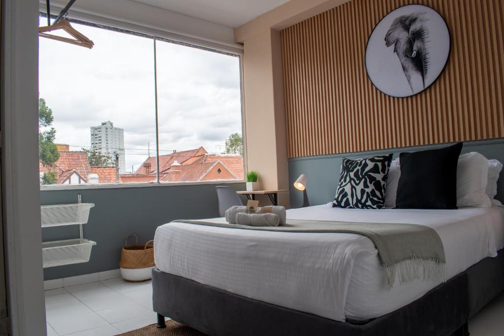 Postel nebo postele na pokoji v ubytování Nomadia Coliving Boutique