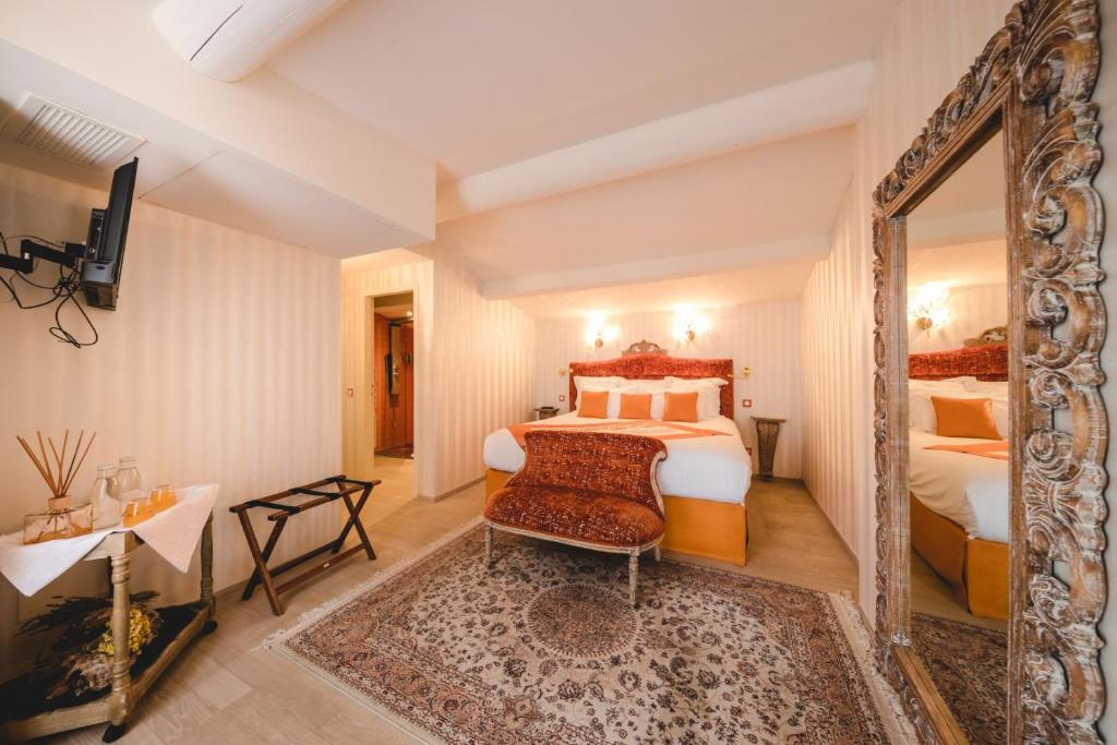 Le Palais d'Aglaé, Hôtel de Charme客房内的一张或多张床位