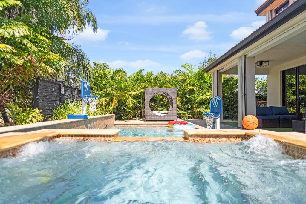 a swimming pool in the backyard of a house at Avatar Miami Villa - Heated Pool & Spa - Pickleball & Cinema in Hammocks