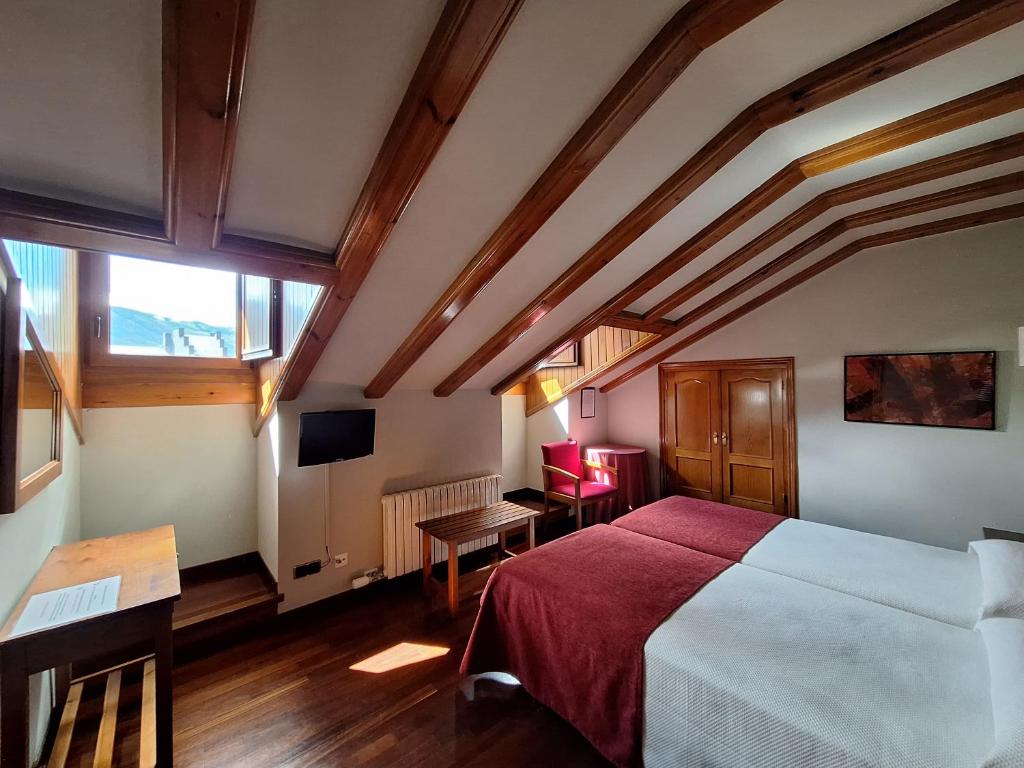 Postel nebo postele na pokoji v ubytování Hotel Aragüells