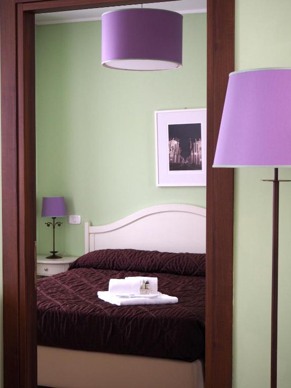 Postel nebo postele na pokoji v ubytování Santa Giulia Hotel e Residence Torino