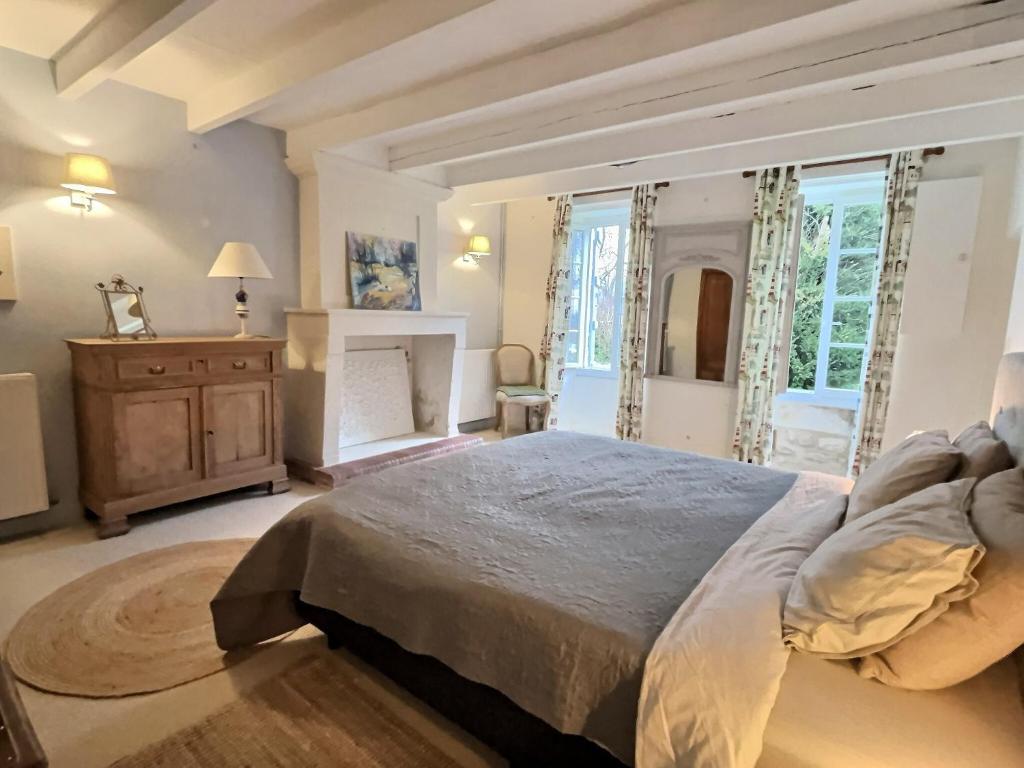 Łóżko lub łóżka w pokoju w obiekcie Gîte Rochellier - Charente-Maritime