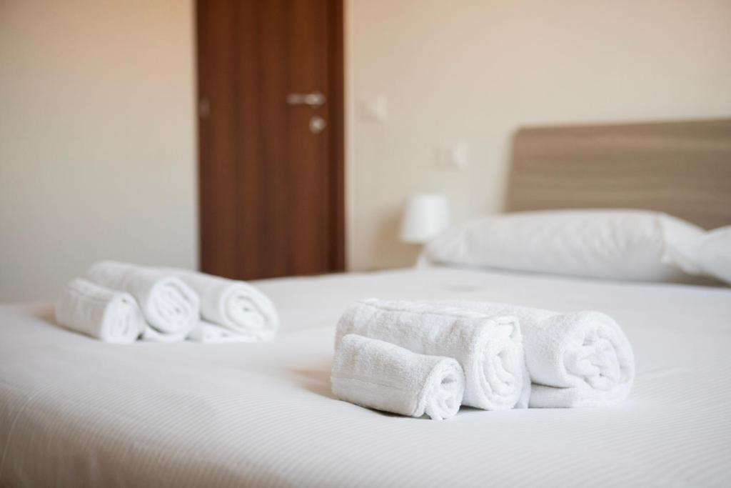 Postel nebo postele na pokoji v ubytování Talenti Boutique Apartment