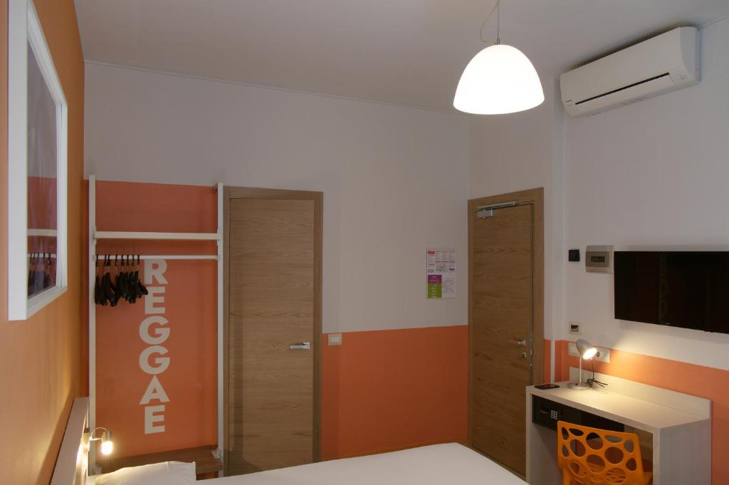 Postel nebo postele na pokoji v ubytování Hotel Nologo
