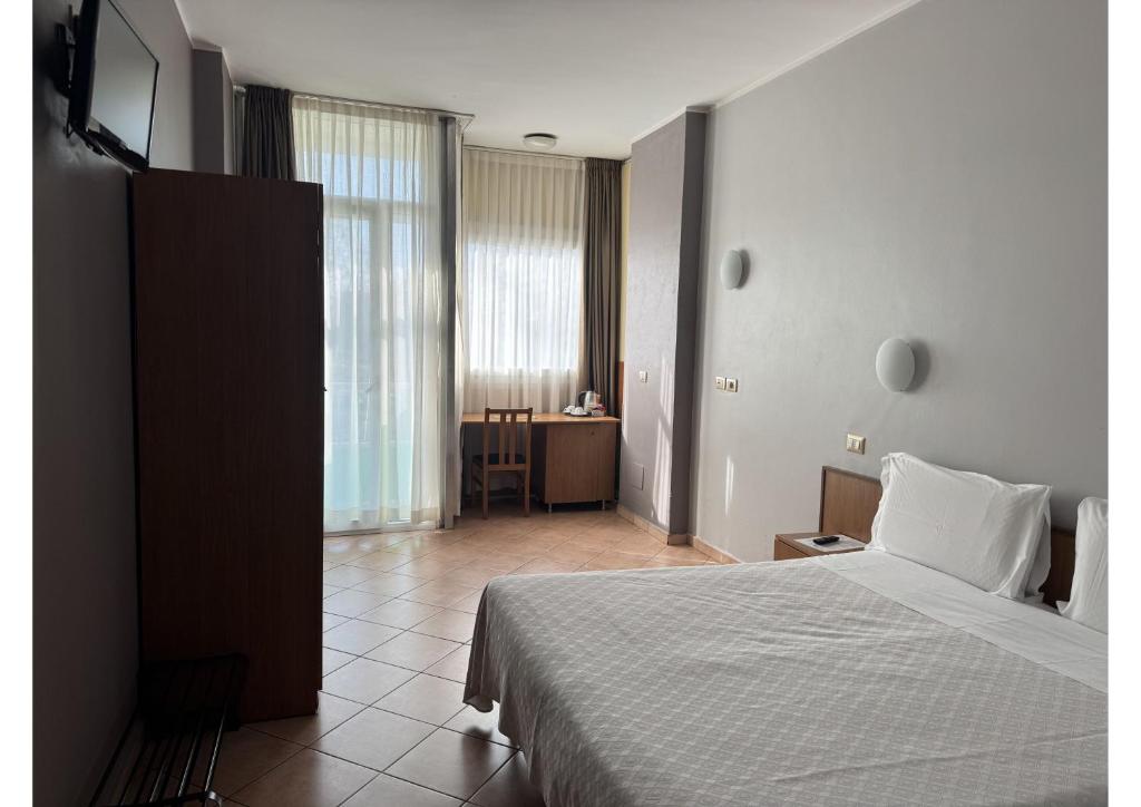 Postel nebo postele na pokoji v ubytování Miramonti Simple Stay
