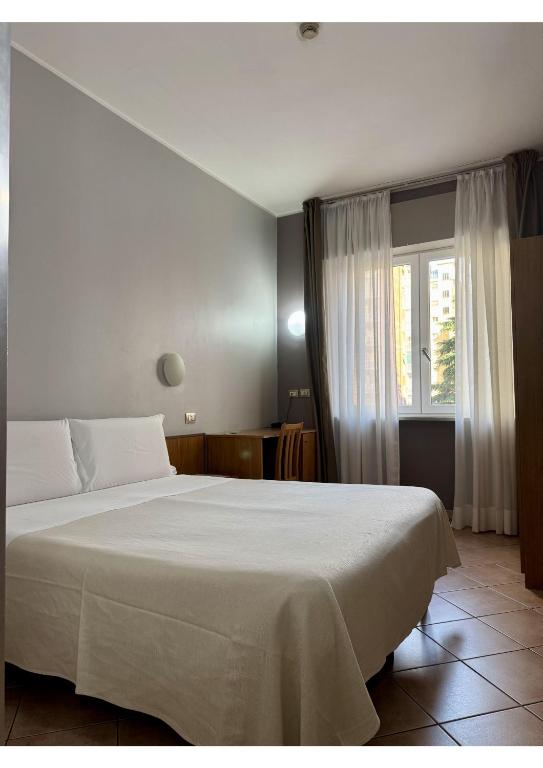 Postel nebo postele na pokoji v ubytování Miramonti Simple Stay