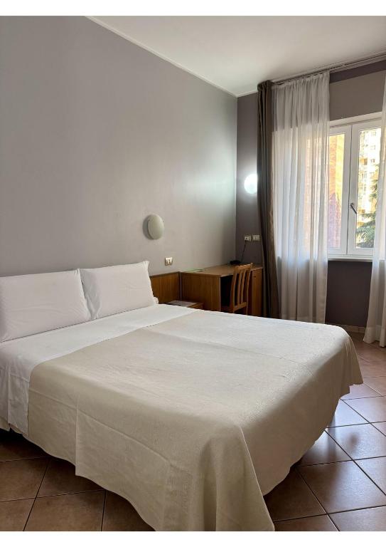 Postel nebo postele na pokoji v ubytování Miramonti Simple Stay