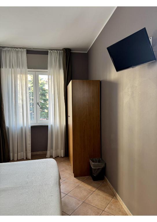 Postel nebo postele na pokoji v ubytování Miramonti Simple Stay