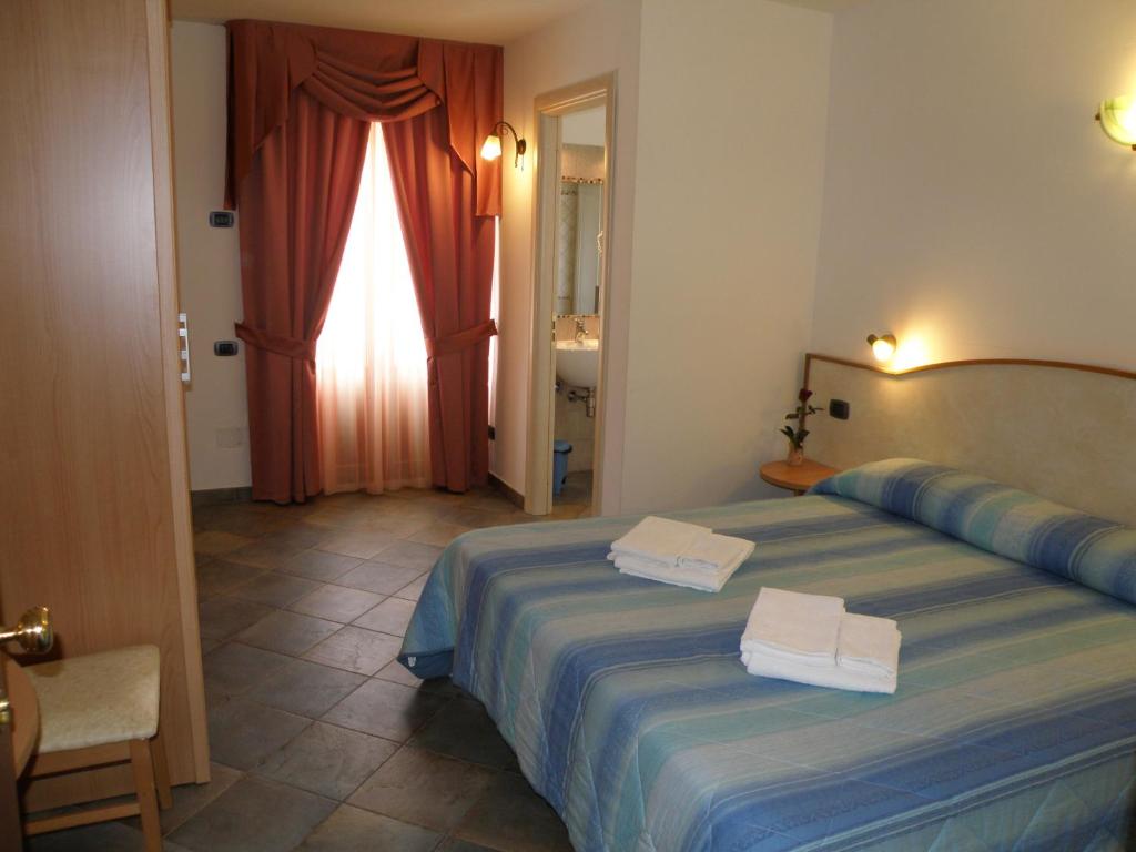 Łóżko lub łóżka w pokoju w obiekcie Casa Hotel Civitella