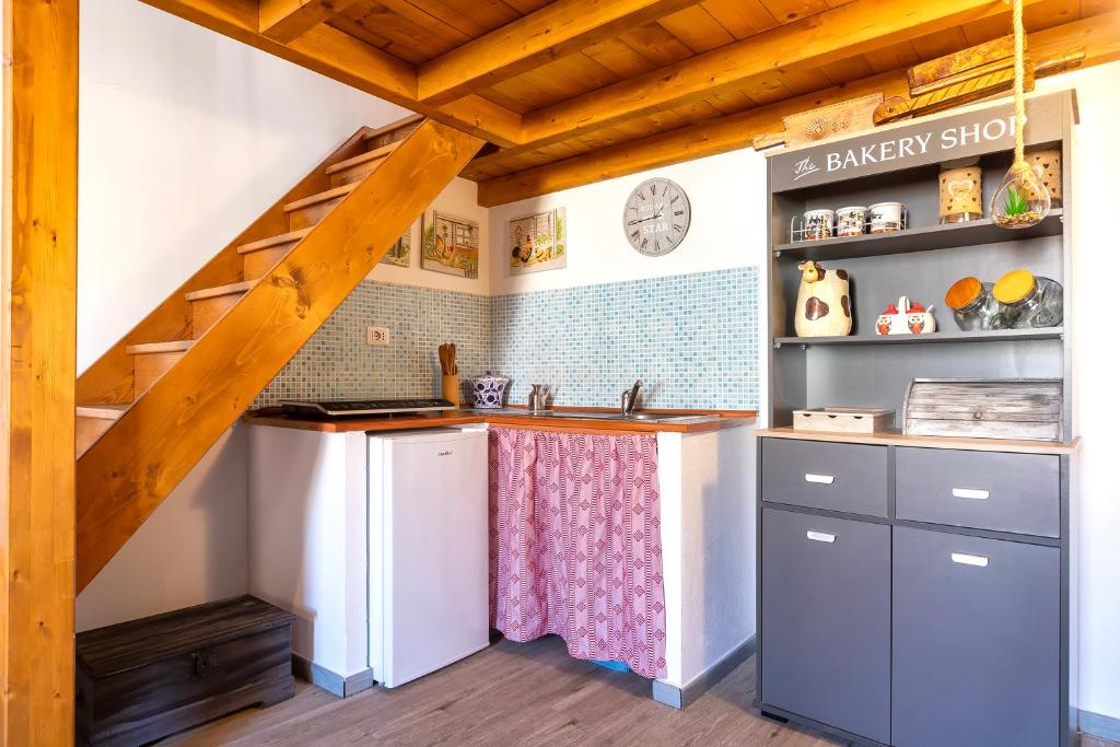 Kuchyň nebo kuchyňský kout v ubytování Alguer Guest House